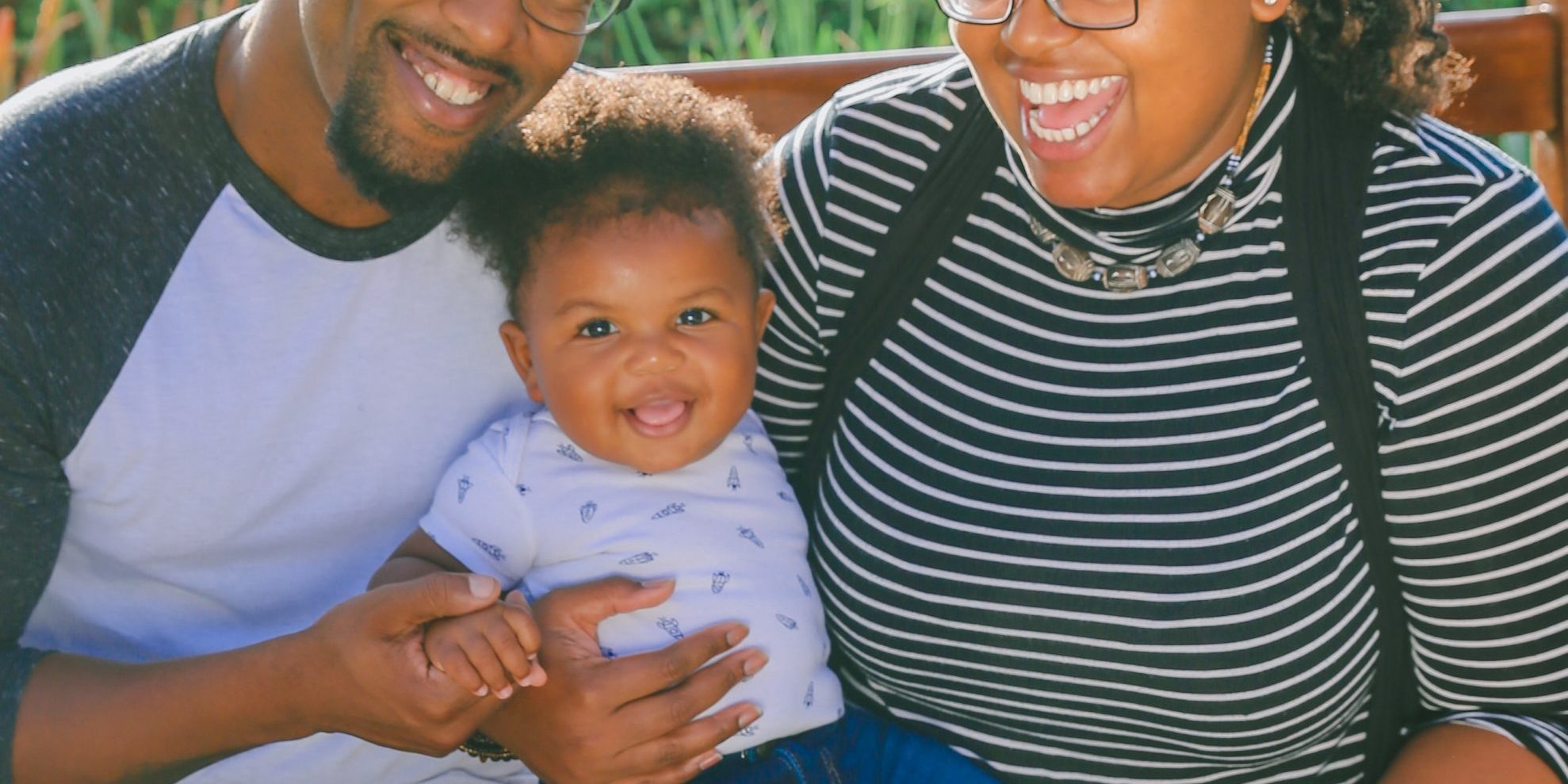 A beautiful black family outside of a family dentistry A beautiful black family outside of a family dentistry